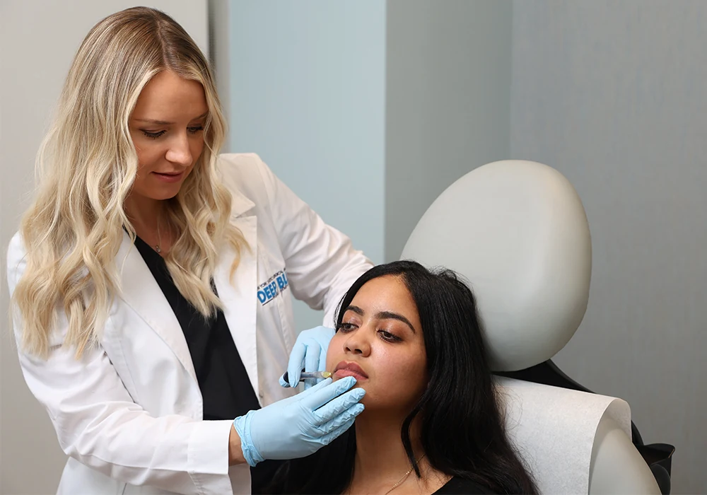 Olga giving lip filler to patient